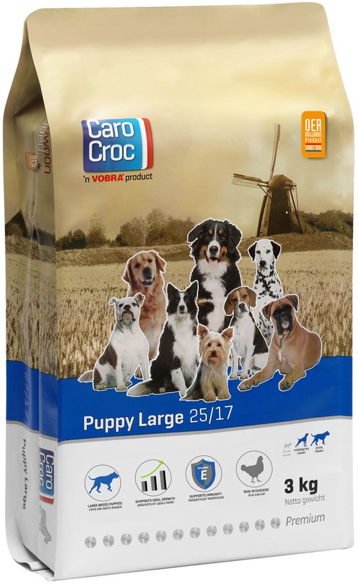 CaroCroc Puppy Large 3 kg voerzak met afbeelding van zeven puppy's en een molen op de achtergrond.