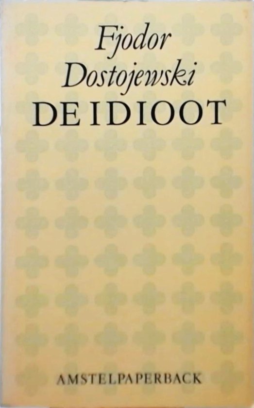 Lichtgele kaft met een patroon van vier klaverbladen. De titel 'DE IDIOOT' en de naam 'Fjodor Dostojevski' staan in zwarte letters.