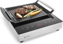 Inductie grillplaat met digitale display, waarop twee steaks, asperges, wortel en knoflook gegrild worden.