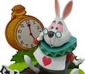 Witte konijn met bril, rode jas, grijze broek en een hart op zijn vest, naast een gele zakhorloge.