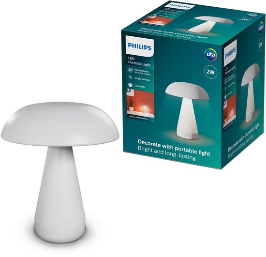 Wit, paddenstoelvormig lampje naast de verpakking. De verpakking toont details van de lamp.