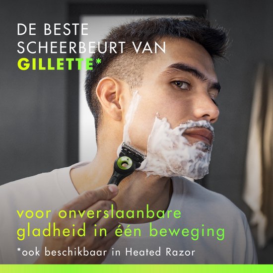 Man met scheerschuim scheert zich met een zwarte Gillette-razor met groene accenten. "De beste scheerbeurt van Gillette".