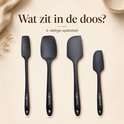 Quatre spatules noires en silicone, présentées sur un fond clair. Titre : 'Qu'y a-t-il dans la boîte ?'.