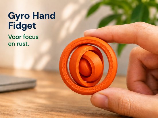 Oranje gyro hand fidget, 5 cm, gehouden door een hand.