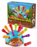 Speelgoed-egel met stekels in regenboogkleuren, op de doos staat 'Eggi de motoriek-egel'.