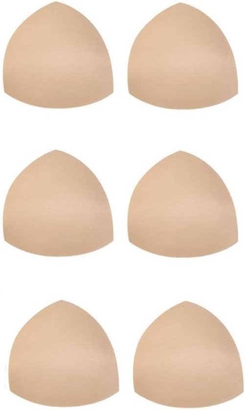 Zes huidkleurige, driehoekige BH-pads gerangschikt in drie rijen van twee tegen een witte achtergrond.