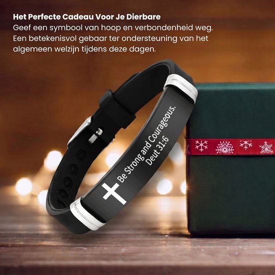Zwarte siliconen armband met zilverkleurige details, de tekst "Be Strong and Courageous. Deut 31:6", naast een kerstcadeau.