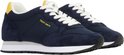 Paar blauwe Teddy Smith sneakers, schuin geplaatst met witte veters.