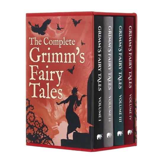Les contes de Grimm complets, volumes I-IV, dans un coffret rouge avec des silhouettes de hiboux, chauves-souris et une silhouette de fée.