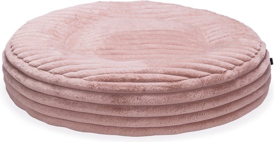 Rond, roze hondenkussen met een dikke ribstof en opstaande rand.