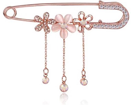 Broche épingle de sûreté couleur or rose avec trois fleurs et cristaux suspendus.