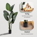 Grote kunstplant van de Paradijsvogelbloem met grote groene bladeren in een zwarte pot.