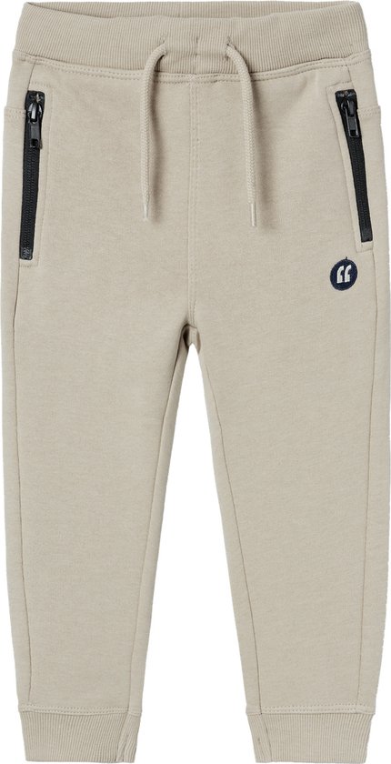 Beige joggingbroek met ritszakken, trekkoord en logoprint.