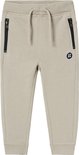 Beige joggingbroek met ritszakken, trekkoord en logoprint.