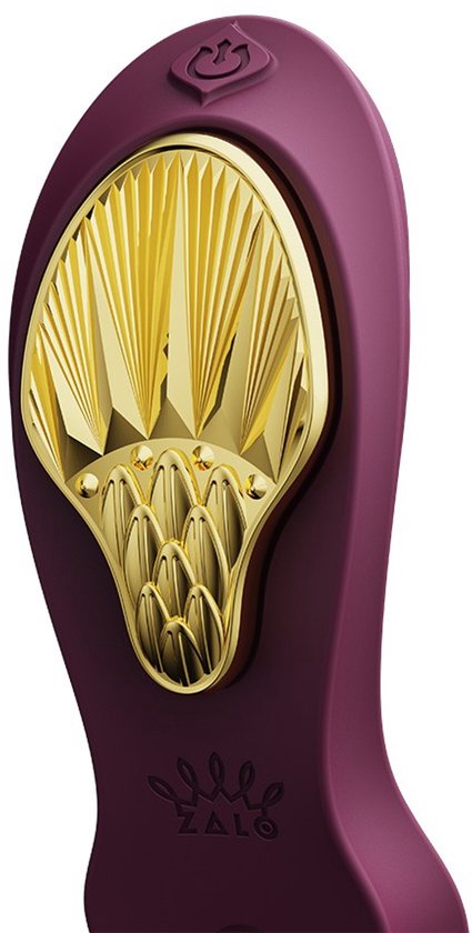 Gros plan du vibrateur violet avec accent doré plié et logo Zalo.