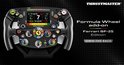 Race stuurwiel met carbonfiber look, Ferrari logo en digitaal display, met tekst 'Own The Race'.