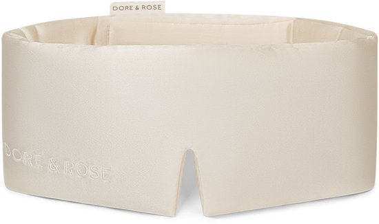 Crèmekleurig zijden slaapmasker van Dore & Rose met inkeping aan de voorkant en geborduurd logo.