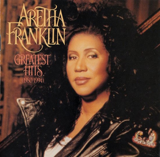 Aretha Franklin met zwarte leren jas en witte top. "Greatest Hits (1980-1994)"
