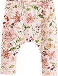 Roze legging met veelkleurige bloemenprint en eendjes.