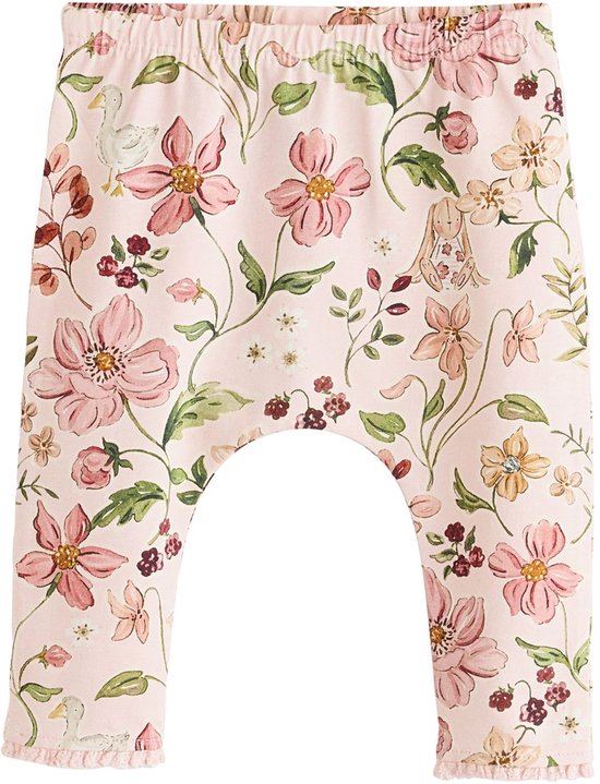 Roze legging met veelkleurige bloemenprint en eendjes.