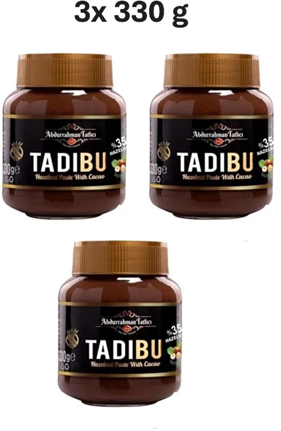 Trois pots de pâte à tartiner aux noisettes Tadibu sur fond blanc, avec le texte '3x 330 g'. Chaque pot contient une pâte brune et a une étiquette noire.