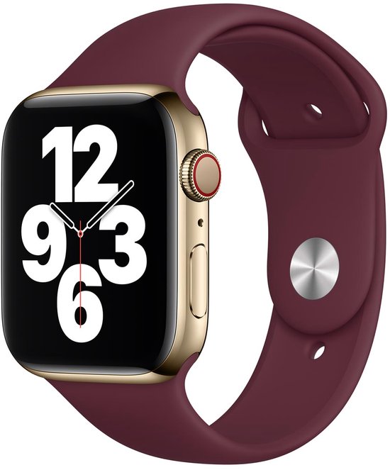 Apple Watch dorée avec bracelet prune. L'écran affiche 12, 9, 6, 3.