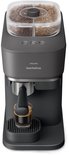Zicht op de bovenkant van de Philips Baristina volautomatische espressomachine met koffiebonen in het reservoir.