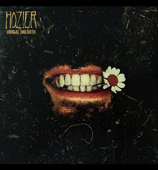 Albumhoes met Hozier's naam en 'UNREAL UNEARTH'. Een mond met witte tanden en een madeliefje in de mond, omringd door donkere aarde.