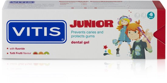 Doos Vitis Junior tandpasta met afbeeldingen van een jongen en een meisje met tandenborstels. Toont "Tutti Frutti flavour".
