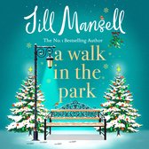 Boekcover van 'A Walk in the Park' door Jill Mansell, met een besneeuwde bank, lantaarnpaal en kerstbomen.