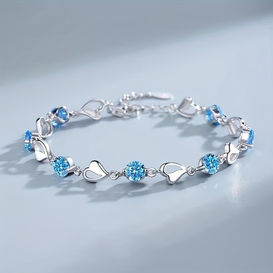 Bracelet Sjika argenté orné de cristaux bleus et de cœurs - Bracelet de Luxe pour femme - Design Elegant et romantique - Cadeau Perfect pour elle