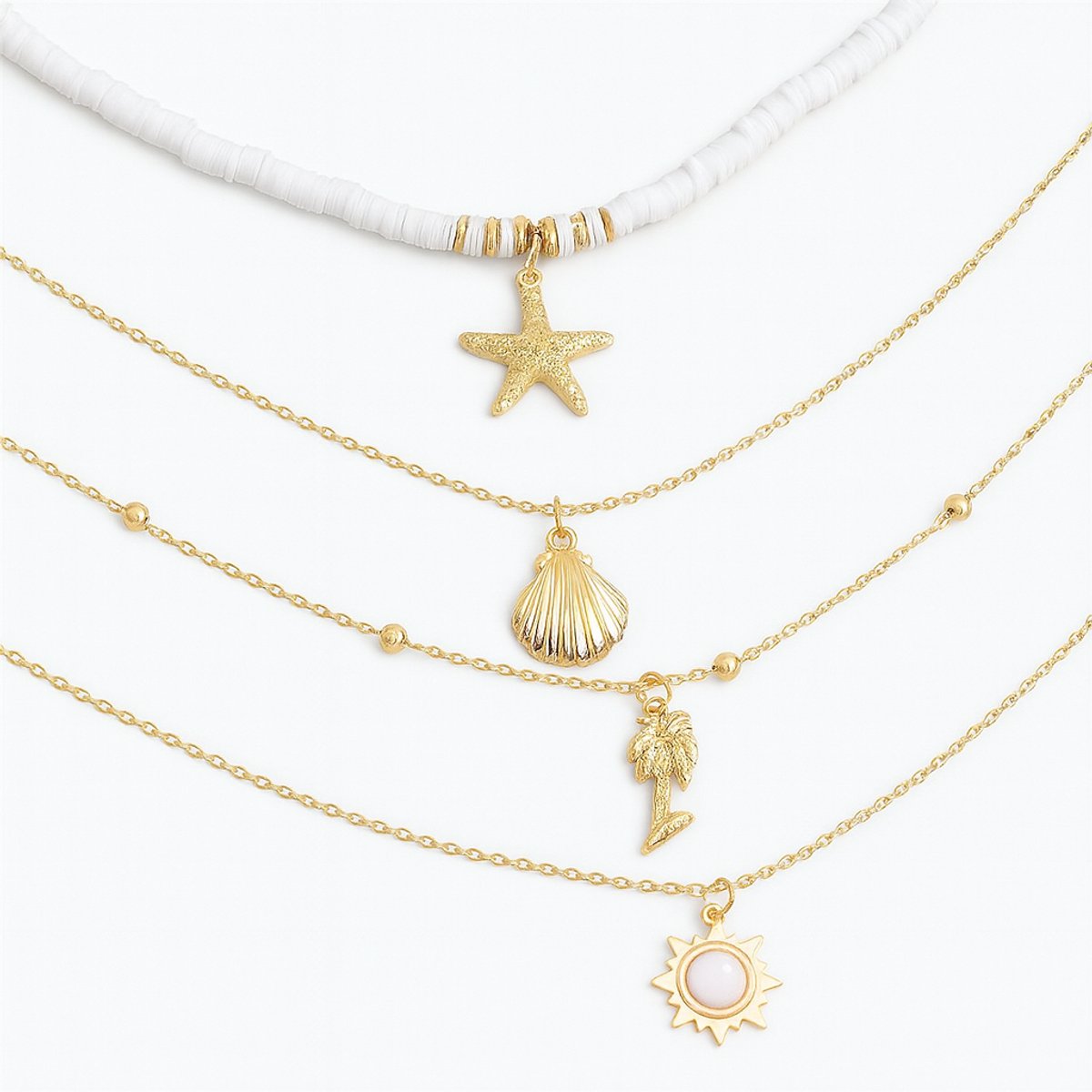 4-delige dames ketting set met zomerse hangers – goudkleurige kettingen met zeester, schelp, palmboom en zonbedel
