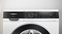 Bedieningspaneel van Siemens iQ500 wasmachine met draaiknop, display en programma's.