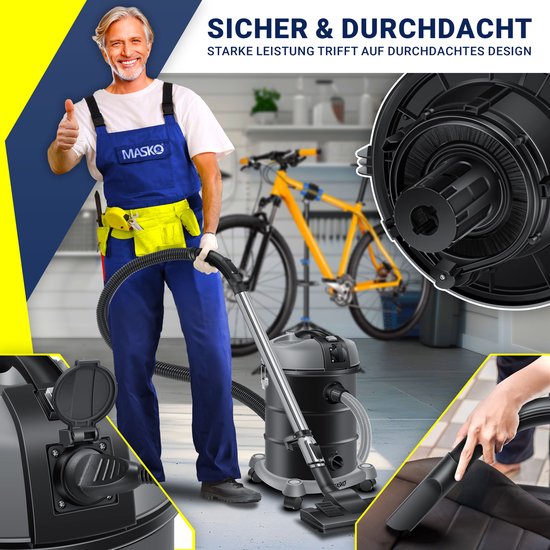 Man met blauwe overall geeft duim omhoog bij een industriële stofzuiger in een garage met fietsen.