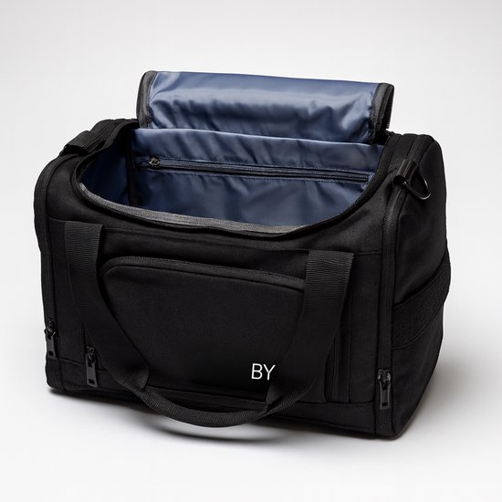 Open zwarte BYMETZ weekendtas met blauwe voering en een binnenvak met rits.