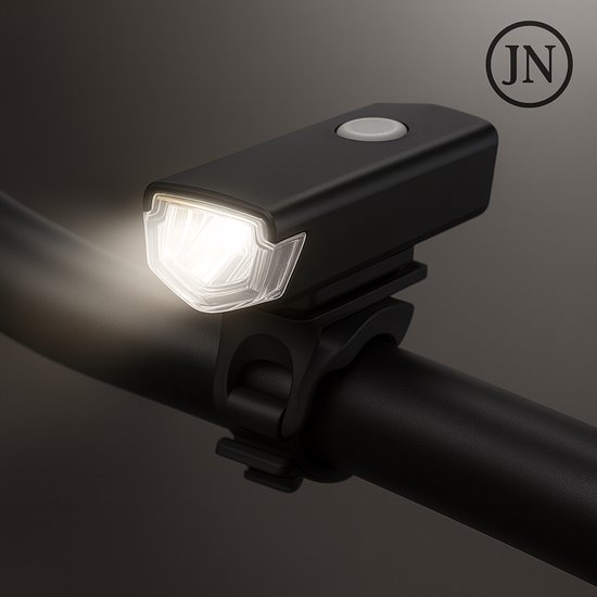 Zwarte fietslamp met verlichting aan, op een fietsstuur.