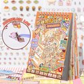 Close-up van een openklapbaar stickerboek, focus op de oranje omslag met capybara's in een bakkerij. Een pincet pakt een sticker. Het boek bevat gedetailleerde illustraties.