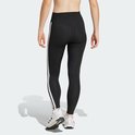 Zicht op de achterkant van een zwarte sportlegging met witte Adidas strepen op de zijkant.