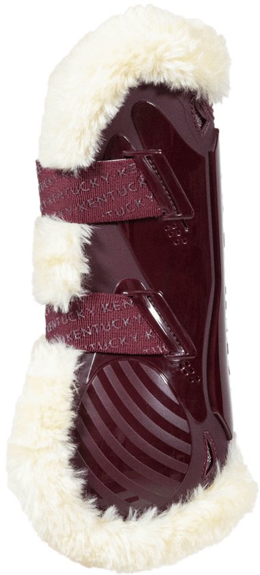 Bordeauxrode peesbeschermer met horizontale ribbels, witte fleece voering en donkerrode banden.