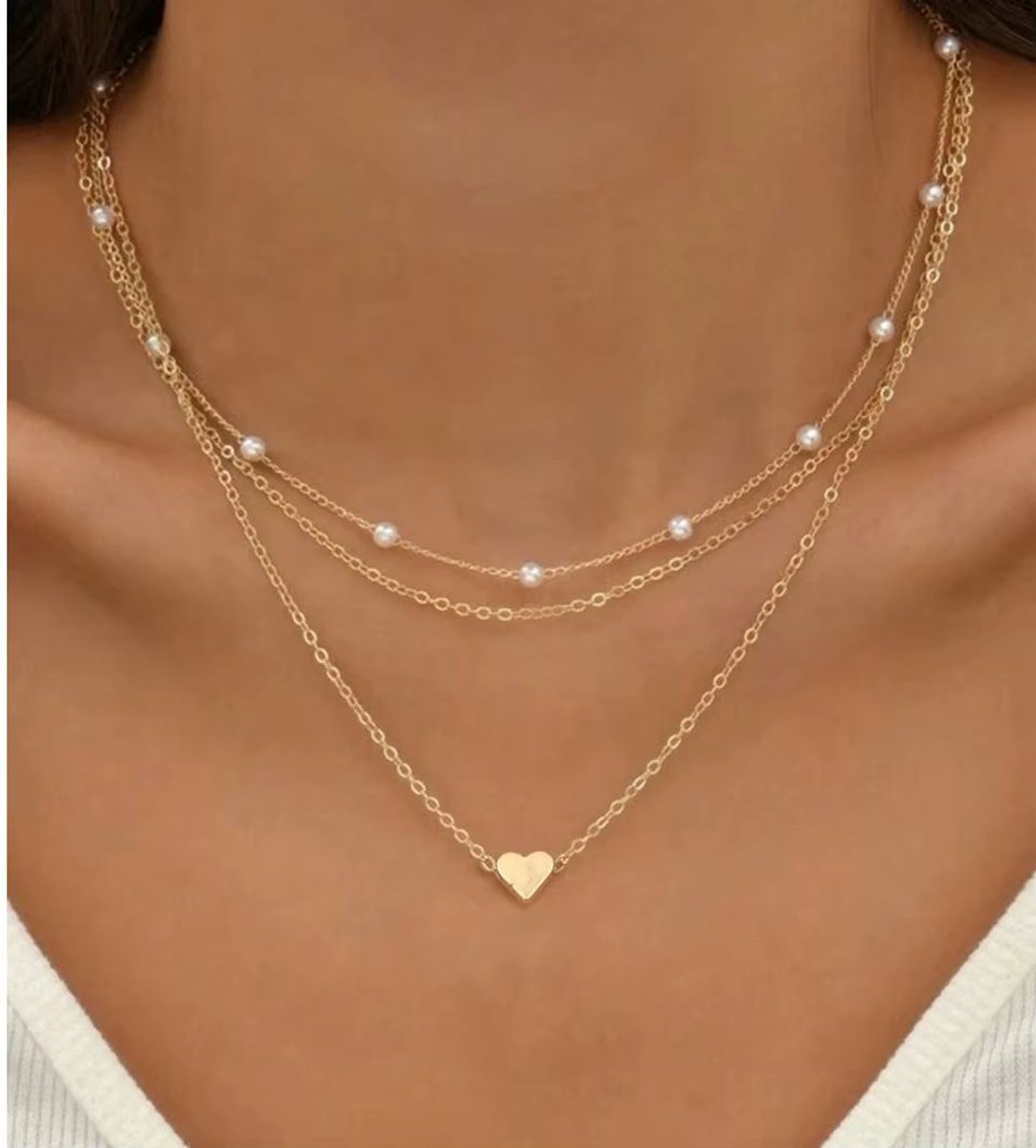 Ketting (duo) met goudkleur parels en hanger hartje