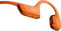 Oranje Shokz OpenRun Pro 2 koptelefoon, detail van knoppen en speaker.
