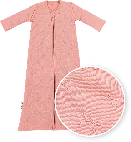 Roze slaapzak met strikjespatroon en rits, met detailfoto.