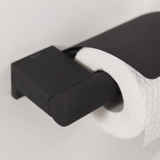 Porte-rouleau de toilette noir avec abattant de Tiger, fixé au mur.