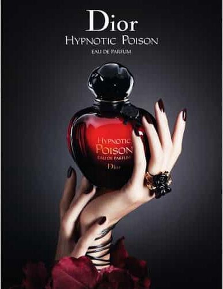 Dior Hypnotic Poison roller-pearl flacon in rode, gedraaide fles met zwarte dop, naast de verpakking.