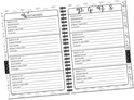 Binnenkant notitieboek met kolommen per letter voor website, gebruikersnaam, wachtwoord en extra info. Links de letters A-Z.