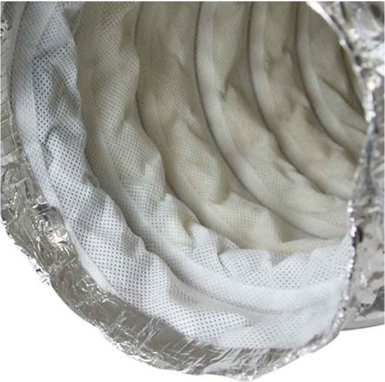 Gros plan détaillé de l'intérieur d'un silencieux flexible argenté avec un tissu blanc non tissé et un ressort métallique.
