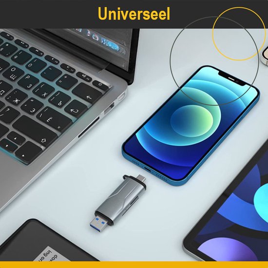 Een zilveren USB-stick ligt naast een laptop, een blauwe smartphone en een tablet.