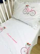 Personalized duvet cover with a pink bicycle and a dedication embroidered