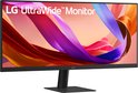 Zwarte LG UltraWide monitor op een zwarte standaard. Scherm toont abstracte kleuren.