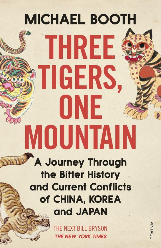 Livre "Three Tigers, One Mountain" avec des illustrations de tigres et un serpent.